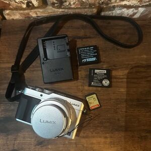 Silver Digital Camera with Accessories